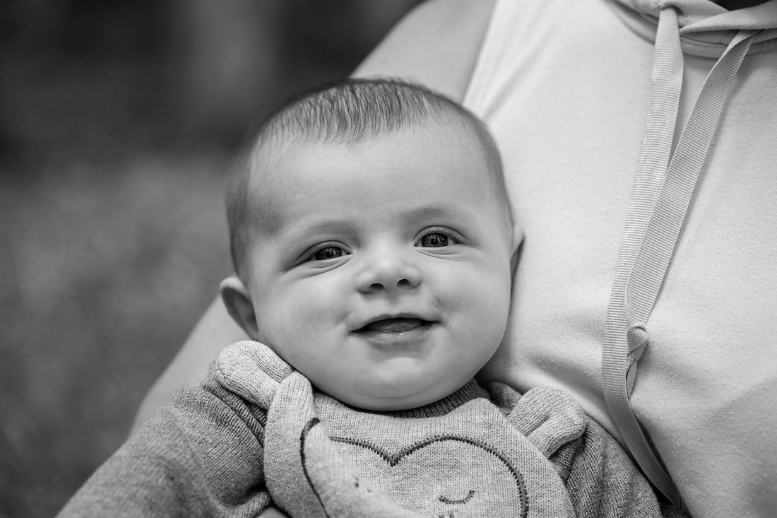 Smiling four month old baby boy
